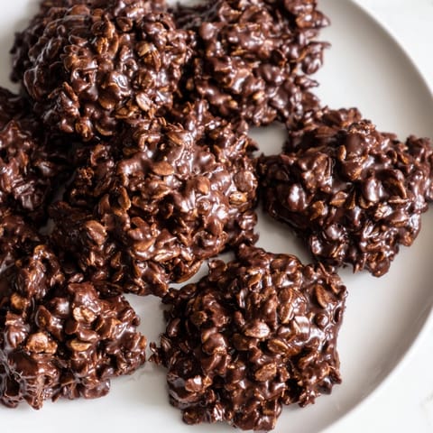 Soft, glistening No-Bake Chocolate Oatmeal Drop Cookies, ready to eat after cooling to set.