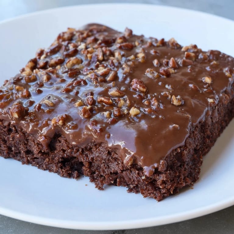 This freshly baked Texas Sheet Cake showcases delicious, rich chocolate and a perfect moist crumb.