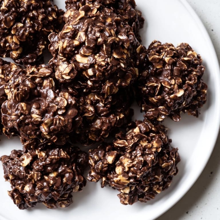 A plate of delicious No-Bake Chocolate Oatmeal Drop Cookies, chewy and perfect with milk.