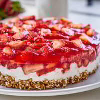 A close-up of Strawberry Pretzel Salad showing the layered textures and fresh strawberries.