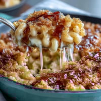 A golden, moist Southern-style cornbread baked in a cast-iron skillet, served warm with luscious honey butter for the ultimate comfort food experience.